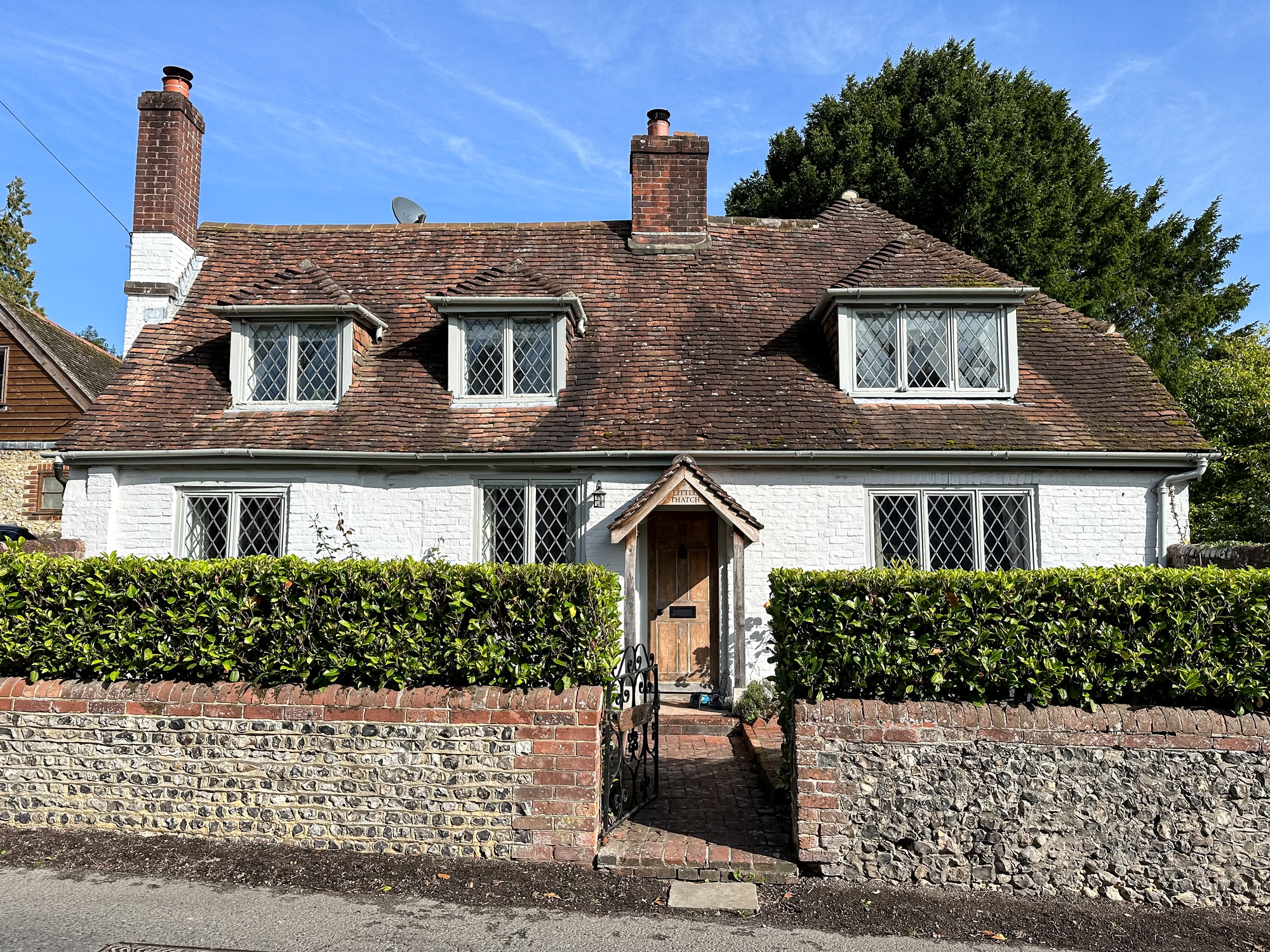 Old houses along the street in West Meon village street view in Hampshire, England, UK.